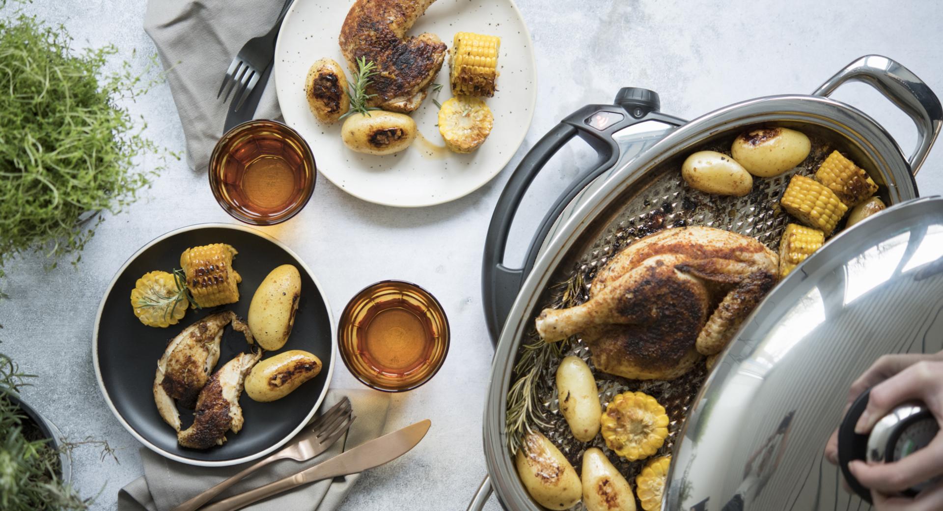 Broiler with potatoes and corncob