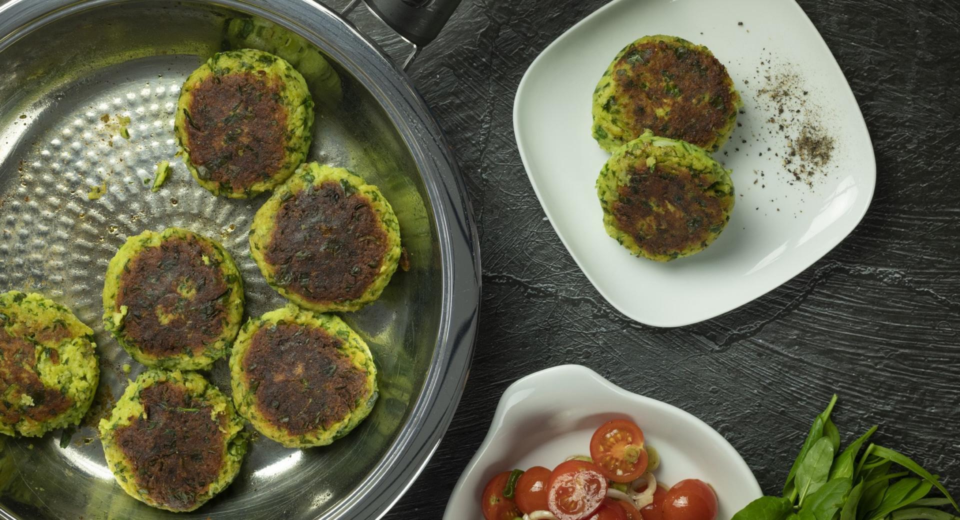 Potato burger with tomato salad