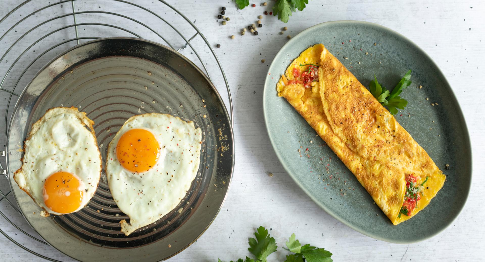 Stuffed omelette and fried eggs