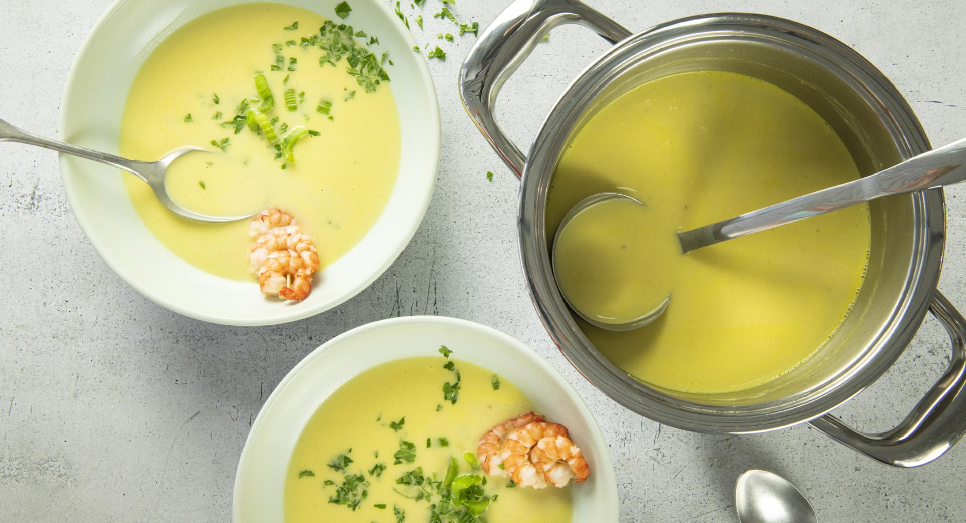 Celery cream soup with shrimp skewers