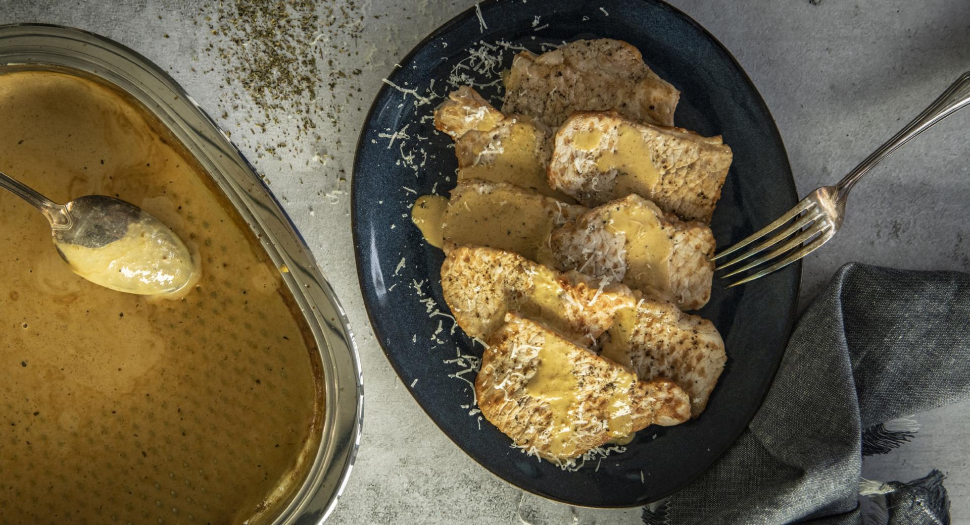 Pork schnitzel with cheese sauce