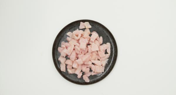 If necessary, remove the thin grey skin from the monkfish. Cut the fish fillet into bite-sized pieces.