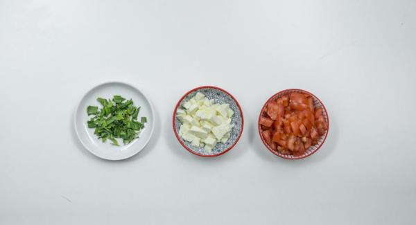 Meanwhile, wash tomatoes and cut into small cubes, drain mozzarella and cut into small cubes in the same way and pluck basil leaves.