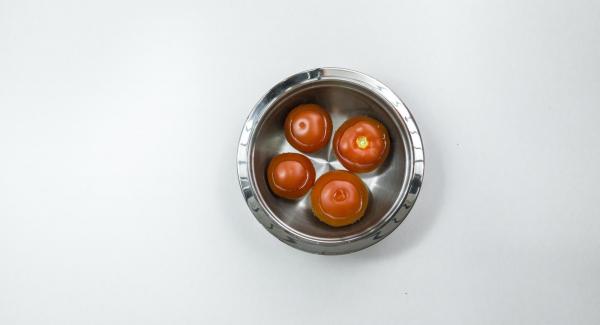 Pour boiling water over the tomatoes, quench, skin and cut into eighths.