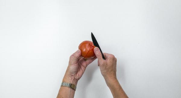 Pour boiling water over the tomatoes, quench, skin and cut into eighths.