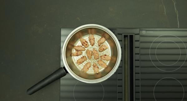 As soon as the Audiotherm beeps on reaching the roasting window, set hob at low level and place the dumplings in the HotPan. Brown the dumplings, turn them, then switch off hob, let them cook for about 4 minutes with the lid on, depending on the size.