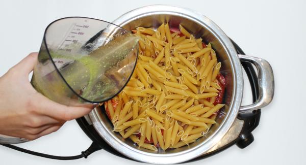 Add the pasta, then pour the vegetable stock.