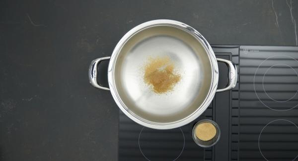 Add a little sugar to Eurasia, put on hob and set it at highest level. As soon as the sugar begins to melt reduce to low level. Gradually add remaining sugar and caramelize everything lightly.