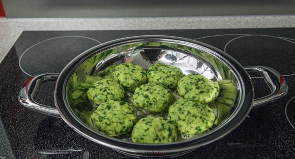 Put butter in a HotPan and switch on the stove at the highest level. As soon as the butter starts to foam, swirl it in the HotPan and place in the potato burger.