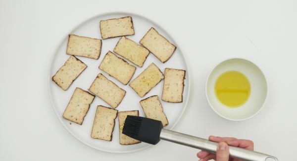 Cut the tofu into four large or several small slices and brush with the remaining oil.