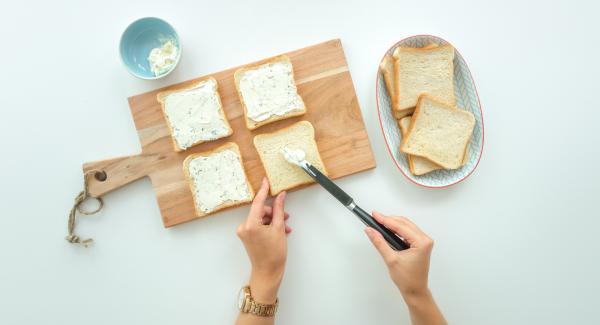 Smear four slices of toast with cream cheese or spread each with a slice of cheese. Spread them with cress, sprouts or salad leaves. Cut the tomato in thin slices and put one on each toast.