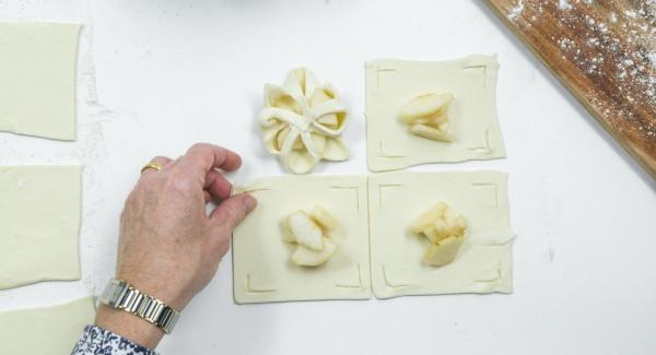 Place a few pear cubes in the middle and fold the edges of the dough over the pears like a flower and press down a little (see photo).