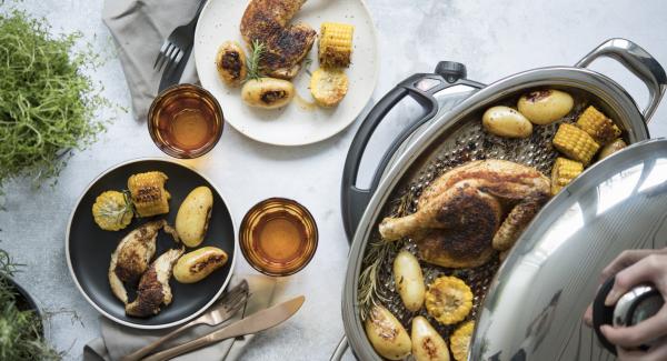 Broiler with potatoes and corncob